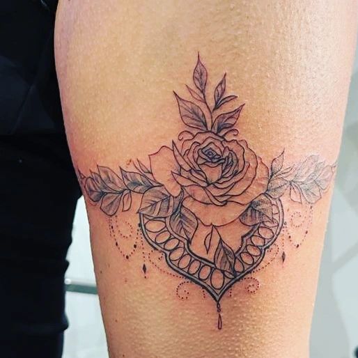 rose garter tattoo