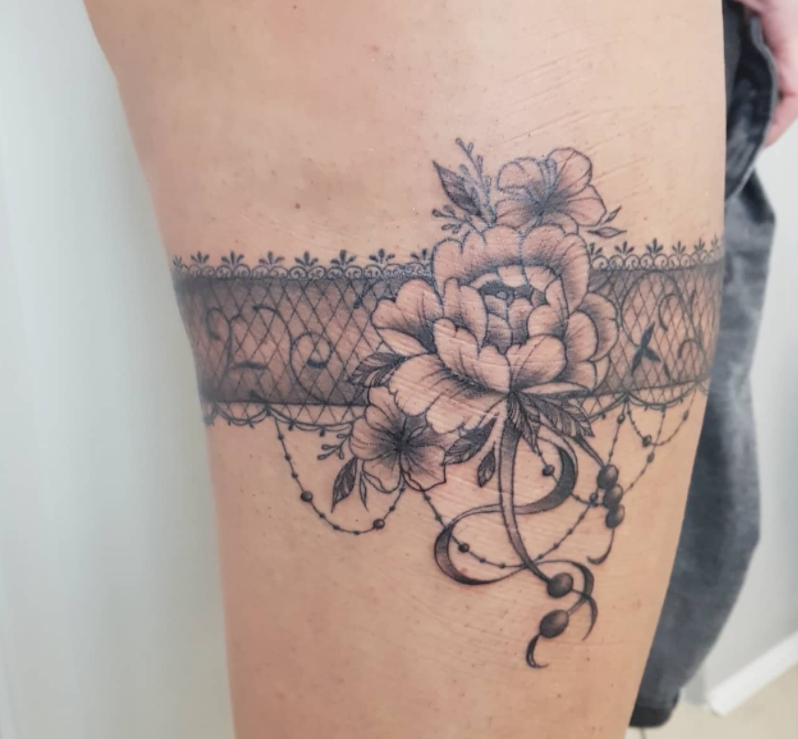 garter tattoo with a flower
