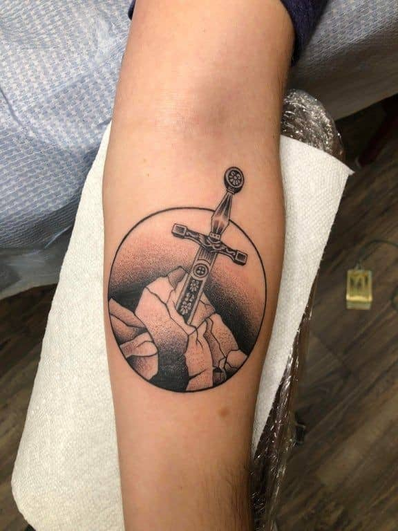 Sword In The Stone Tattoo